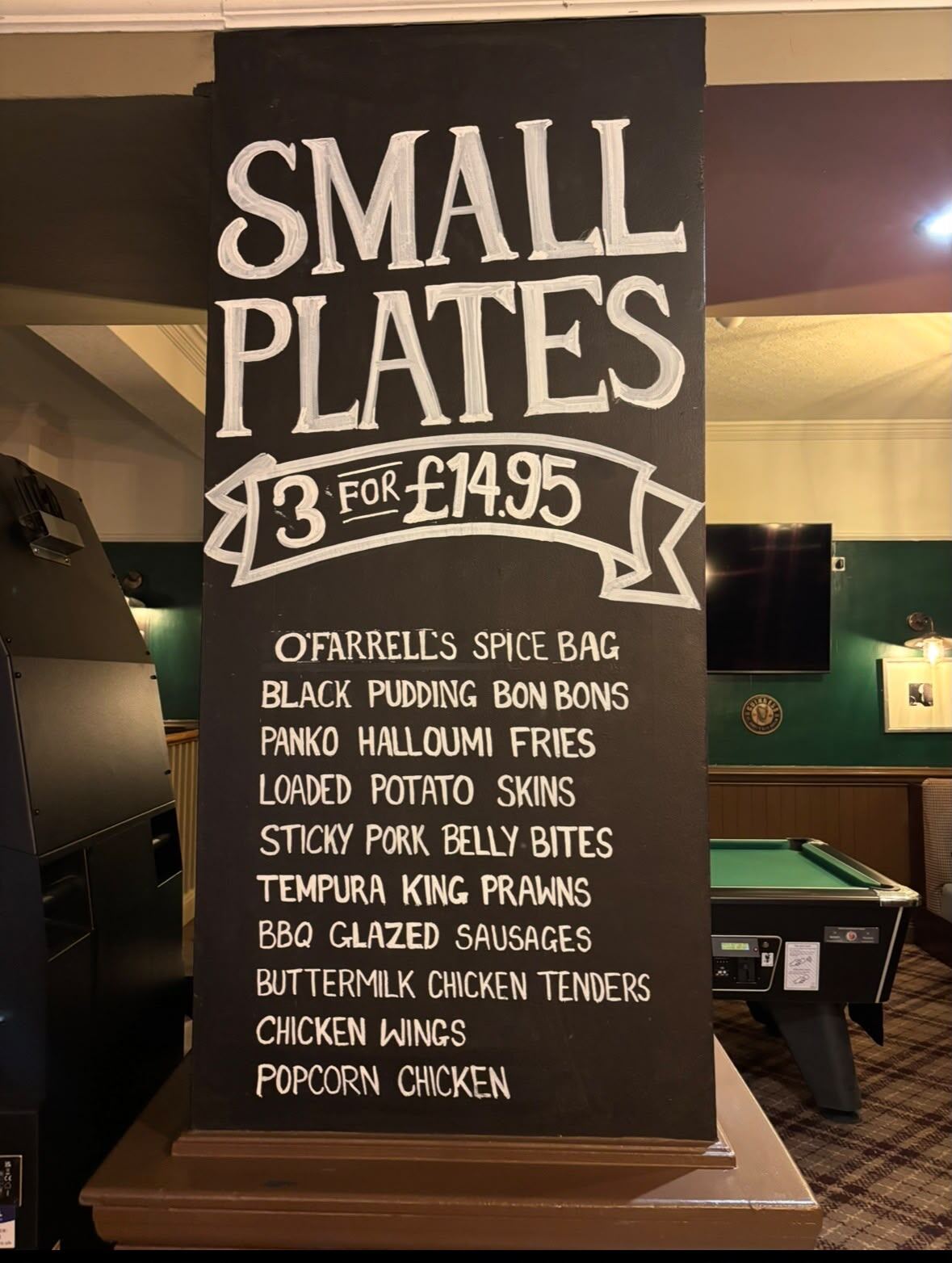 The hand-lettered Small Plates chalkboard at O'Farrell's listing the mix-and-match three-for-£14.95 dishes